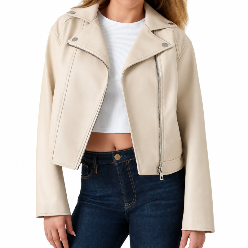 Front view of a model wearing an off-white faux leather biker jacket over a white crop top and blue jeans